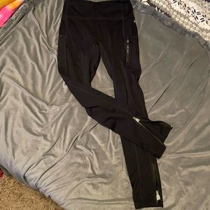 Black Fabletics leggings with zipper detailing
